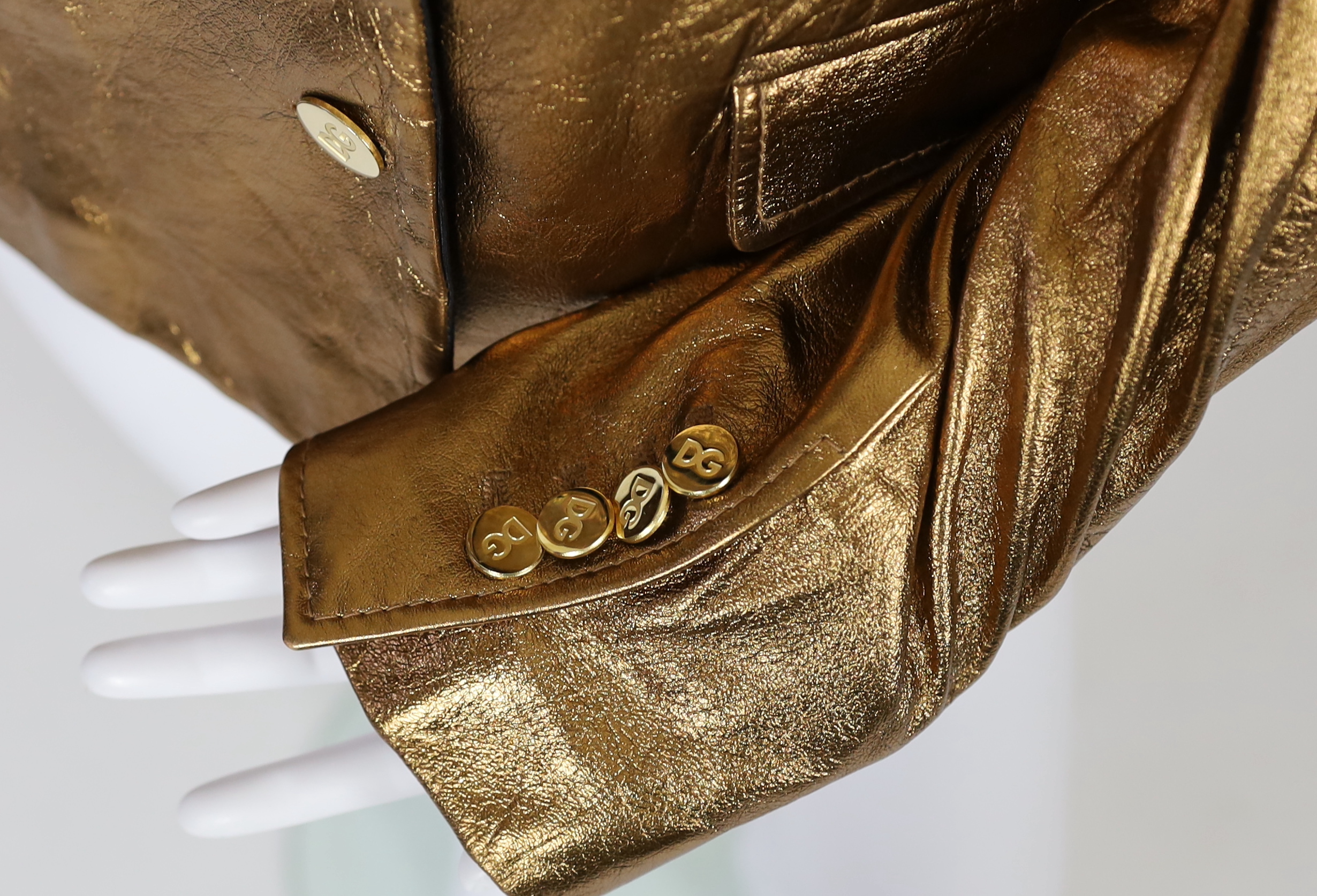 A lady's Dolce & Gabbana gold metallic leather jacket, size 42